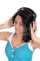 Woman listening to music with headphones.