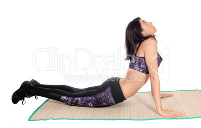 Exercising woman on a mat.