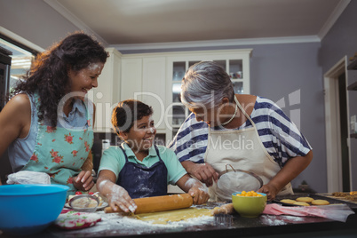 Family preparing dessert in kitchen