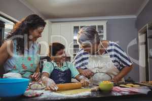 Family preparing dessert in kitchen