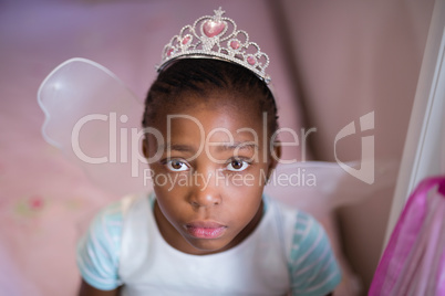 Serious little girl wearing fairy costume