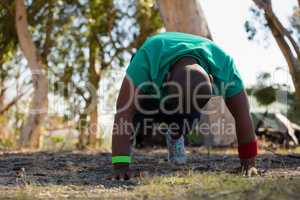 Boy exercising during obstacle course training