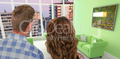 Composite image of rear view of young couple standing