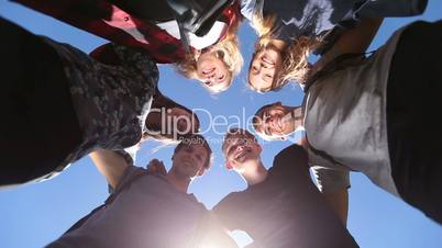 Smiling group of teenage friends in circle