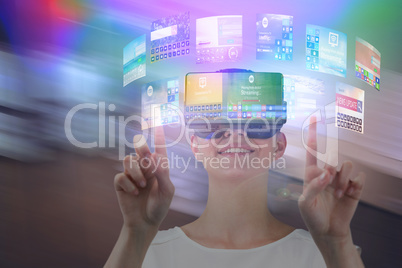 Composite image of happy woman pointing upwards while using virtual reality headset