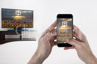 Composite image of female hand holding a smartphone