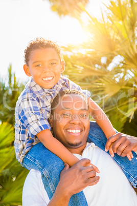 Mixed Race Son and African American Father Playing Piggyback Out