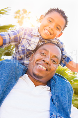 Mixed Race Son and African American Father Playing Piggyback Out