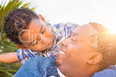 Mixed Race Son and African American Father Playing Piggyback Out