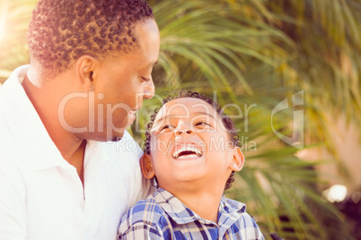 Mixed Race Son and African American Father Playing Outdoors Toge