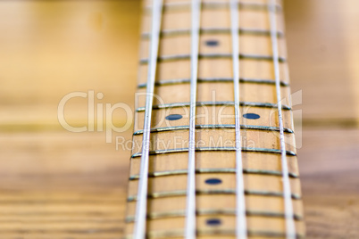 closeup of electrical bass guitar fingerboard