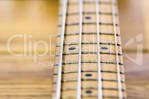 closeup of electrical bass guitar fingerboard
