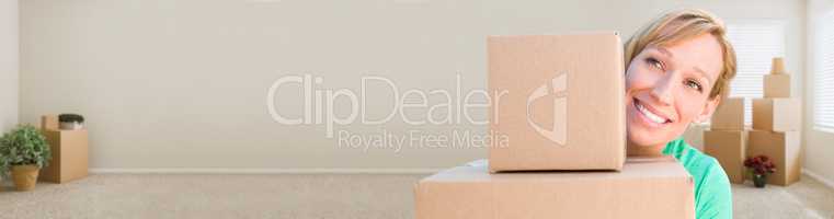 Banner of Happy Young Adult Woman Holding Moving Boxes In Empty