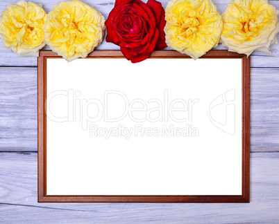 Empty wooden frame on a white wooden background, at the top of t