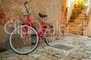 Red Bicycle on the Narrow Street of the Old City