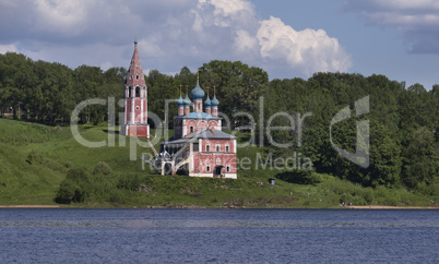 The church stands on the high bank of the river.