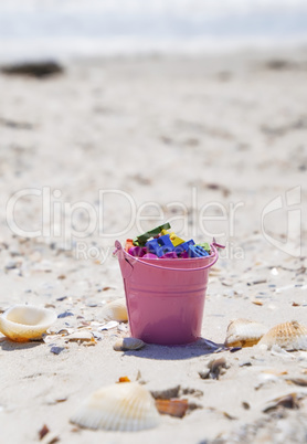 bucket full of wooden multicolored letters