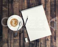 Notepad and coffee cup