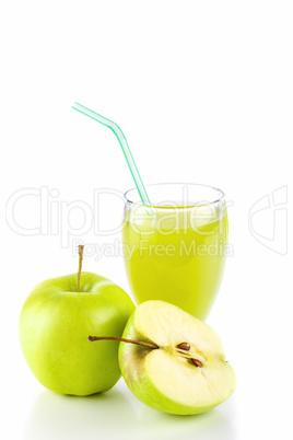 Apple juice in glass and green apples