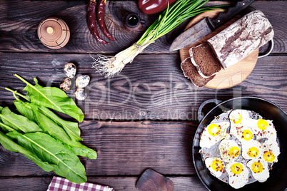 Fried quail eggs in a frying pan,