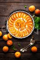 Apricot cake or pie with fresh fruits, cheesecake