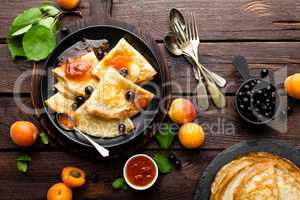 Pancakes with fresh blackcurrant and apricot jam