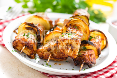 Grilled shish kebab or shashlik on skewers closeup on white background