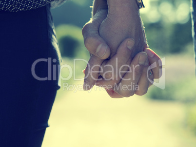 Couple holding hands