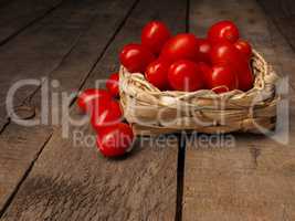 Organic grape tomatoes on a wooden table