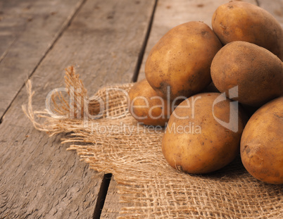 Rich harvest, organic potatoes on a rustic table