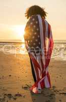 Mixed Race African American Girl Woman Wrapped in US Flag Beach