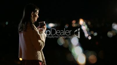 Gorgeous woman enjoying night city lights