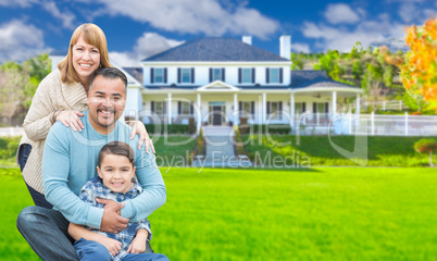 Mixed Race Family In Front Yard of Beautiful House and Property.