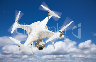 Unmanned Aircraft System (UAV) Quadcopter Drone In The Air.