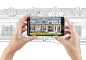 Hands Holding Smart Phone Displaying Home Photo of Drawing Behin
