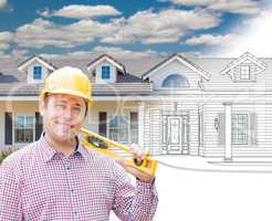 Male Contractor Wearing Hard Hat In Front of House Drawing Grada