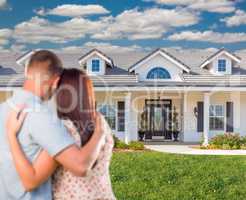 Young Military Couple Facing Beautiful New House.
