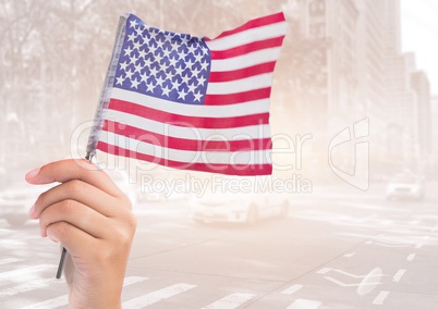 Hand holding american flag