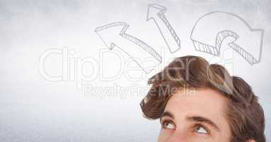 Top of man's head looking up at upward 3D arrows against white wall
