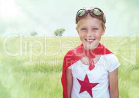 Superhero boy against meadow with flare