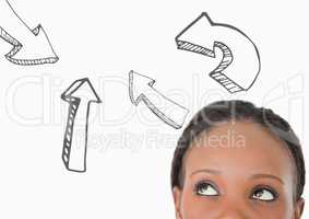 Top of woman's head looking at 3D grey arrows against white background