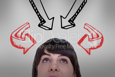 Woman looking upwards with arrows above her heads