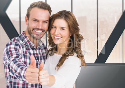 Couple thumbs up at home