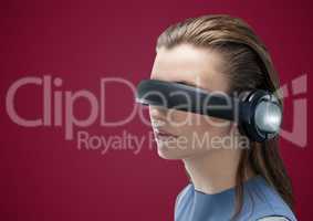 Woman in virtual reality headset against maroon background