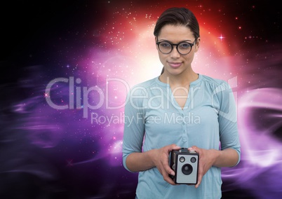 Photographer holding camera against galaxy background