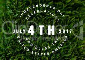 White fourth of July graphic against grass