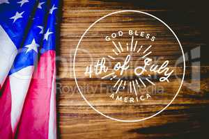 4th of July design on wooden background with american flag