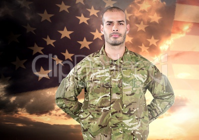 Proud soldier standing on american flag background
