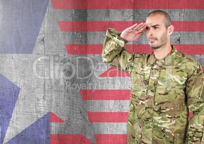 Proud soldier saluting against american flag background