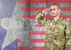Proud soldier saluting against american flag background